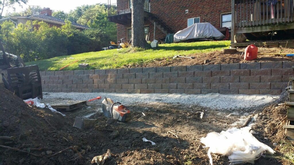 Segmental block retaining wall built into a sloped Chicago-area back yard