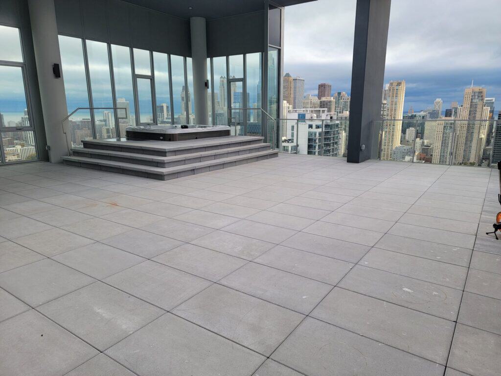 Bare paver terrace on a downtown Chicago high-rise before turf was installed