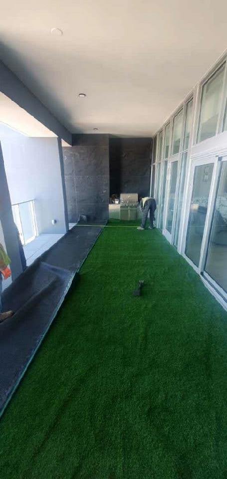 Artificial turf installed on a rooftop terrace