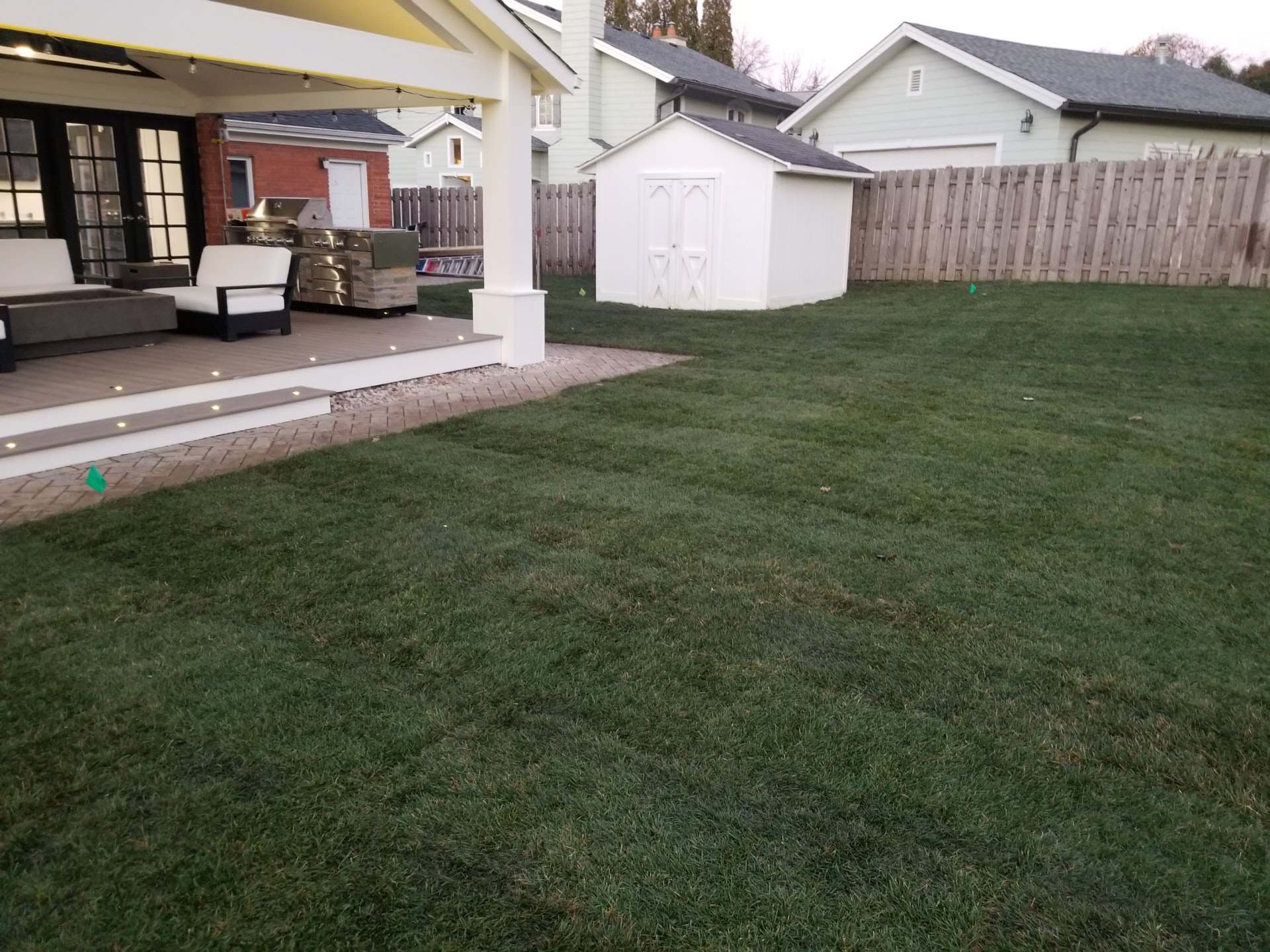 Covered patio and new lawn in a finished Chicago-area backyard