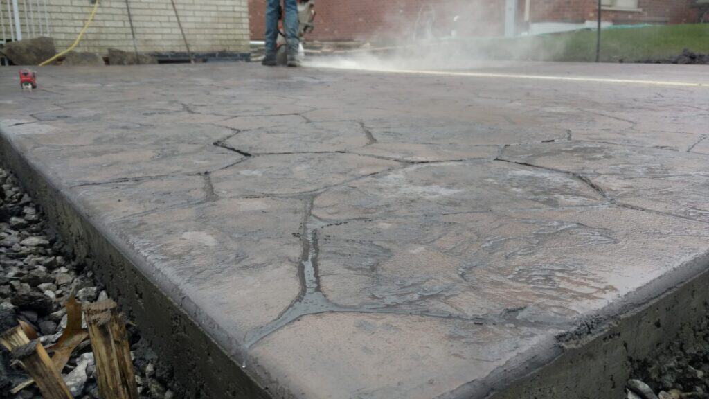 Stamped concrete patio installed by Streamline Landscaping