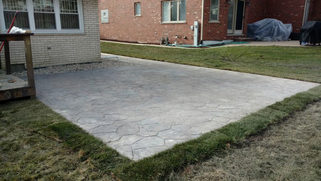 New poured concrete patio behind a Chicago-area home