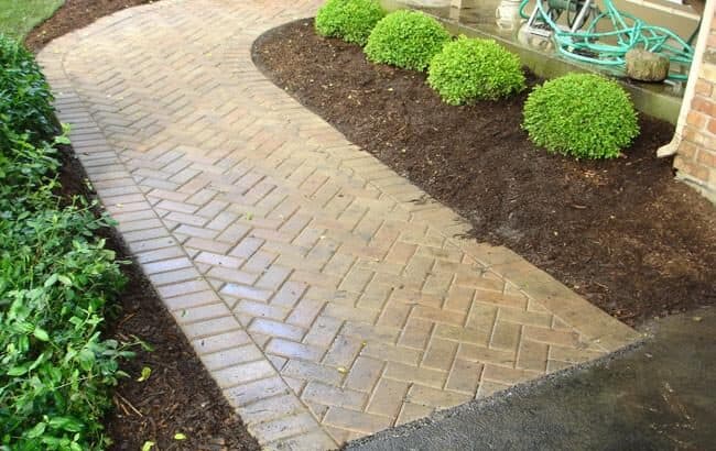 Herringbone Prairie Hollandstone walkway with new boxwood planting