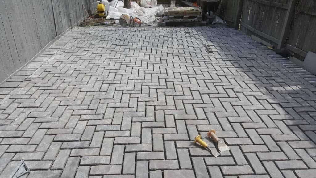Herringbone paver patio installed by Streamline Landscaping