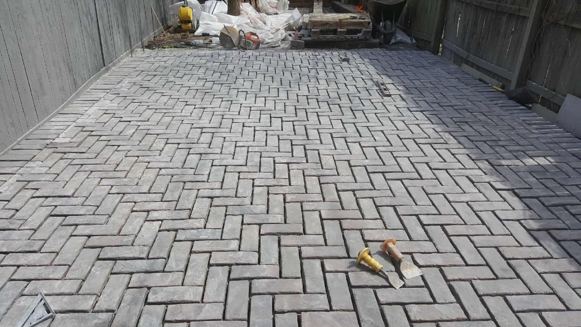 Herringbone paver patio installed by Streamline Landscaping