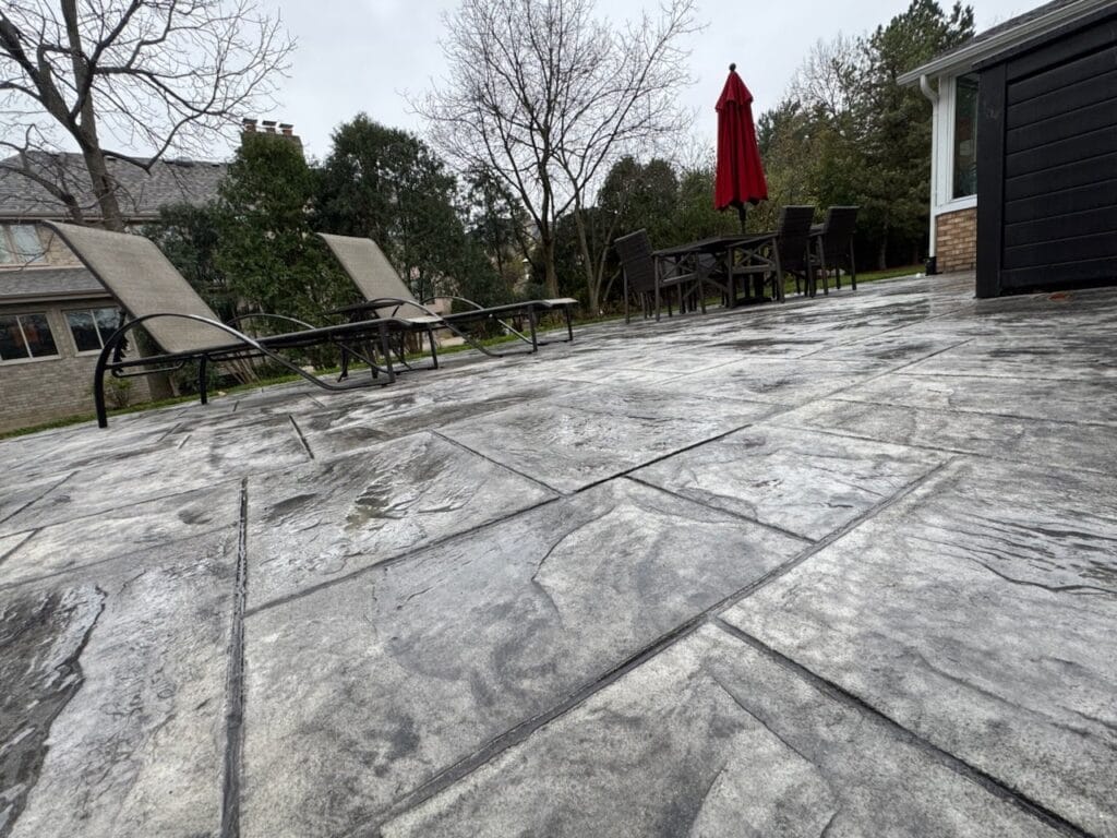 Finished stamped concrete patio with a cut stone pattern